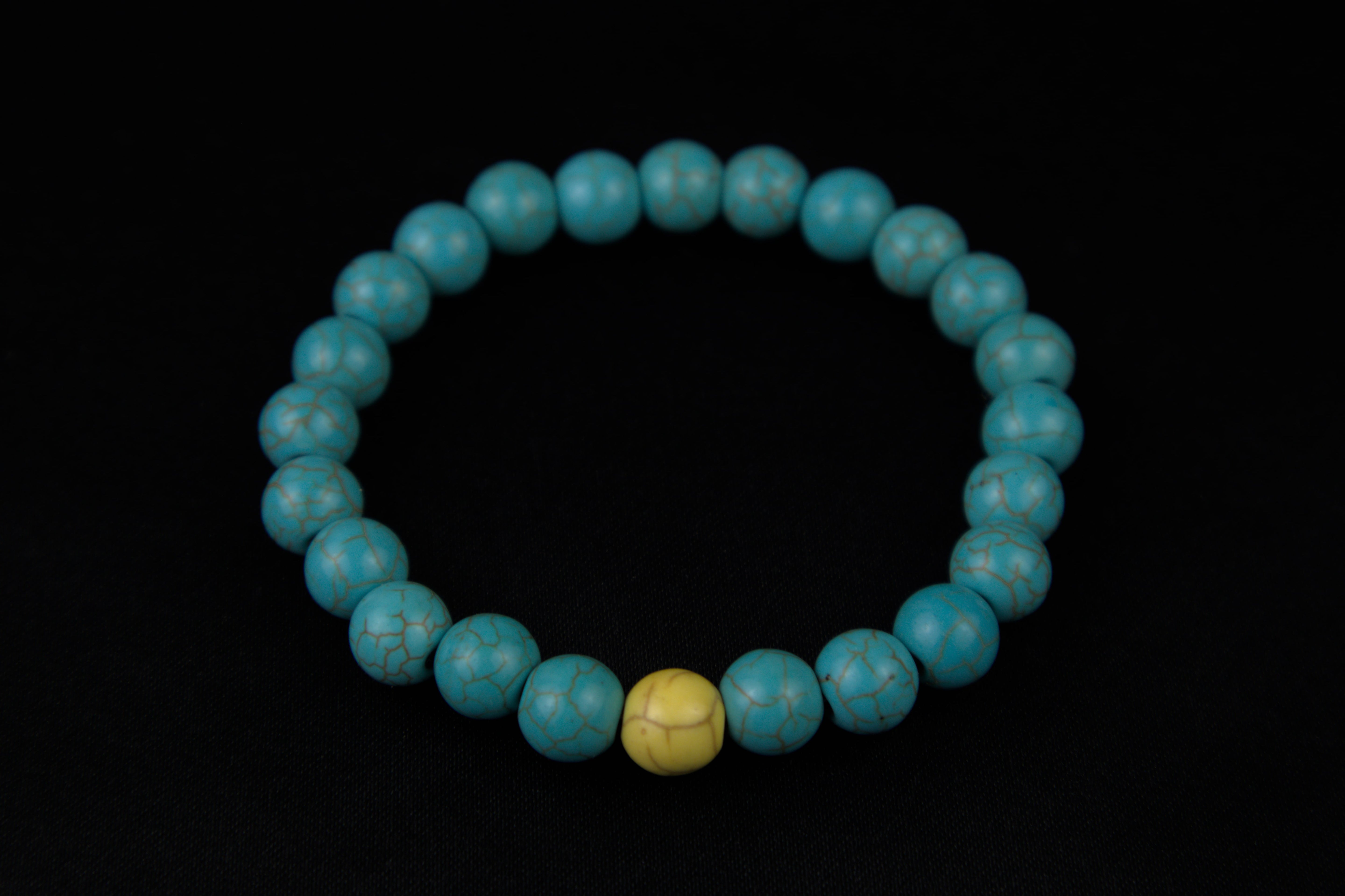 Pulseras de la distancia azul con amarillo